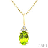 1/50 Ctw Oval Cut 6X4 MM Peridot and Round Cut Diamond Semi-Precious Pendant With Chain in 10K Yellow Gold