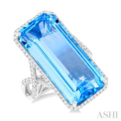 26x12 MM Emerald Cut Blue Topaz and 1/2 Ctw Round Cut Diamond Halo Semi-Precious Ring in 14K White Gold