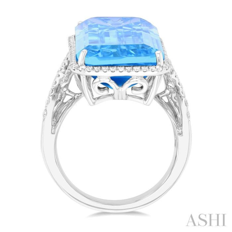 26x12 MM Emerald Cut Blue Topaz and 1/2 Ctw Round Cut Diamond Halo Semi-Precious Ring in 14K White Gold