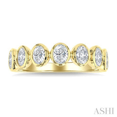 1 1/4 Ctw 7 Stone Bezel Set Oval Cut Diamond Fashion Band in 14K Yellow Gold