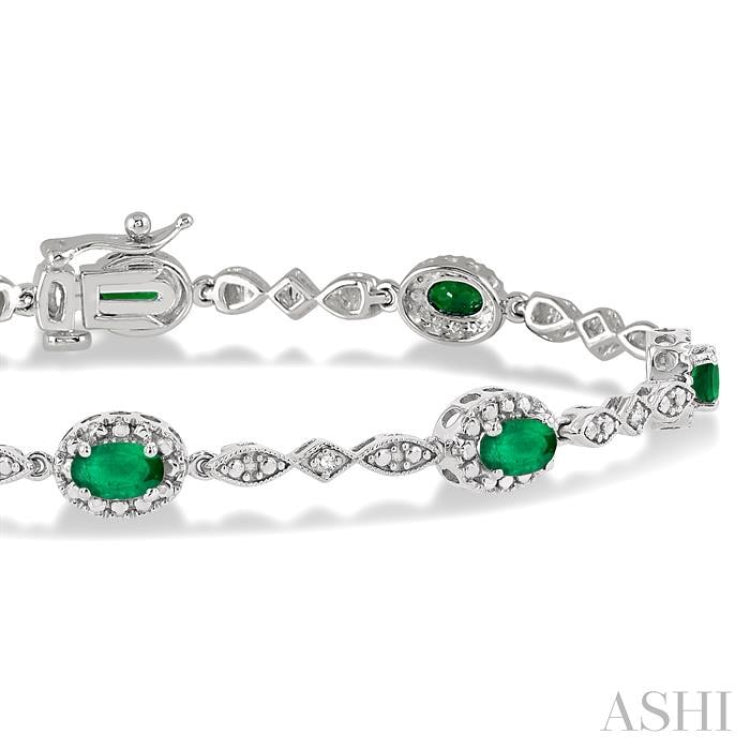 5x3 MM Oval Cut Emerald and 1/20 Ctw Single Cut Diamond Bracelet in 10K White Gold