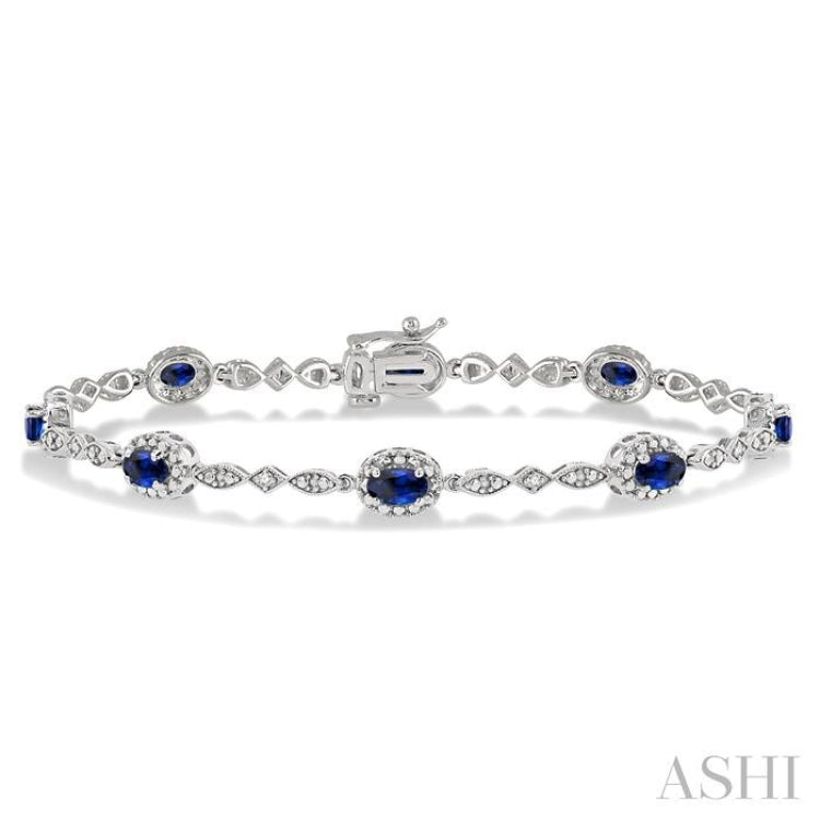 5x3 MM Oval Cut Sapphire and 1/20 Ctw Single Cut Diamond Bracelet in 10K White Gold