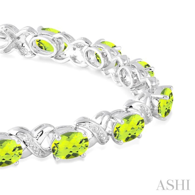 7x5  MM Oval Cut Peridot and 1/20 Ctw Round Cut Diamond Fashion Bracelet in Sterling Silver