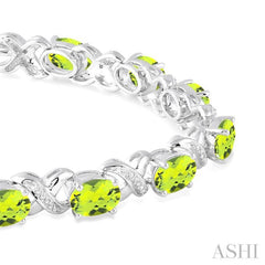 7x5  MM Oval Cut Peridot and 1/20 Ctw Round Cut Diamond Fashion Bracelet in Sterling Silver