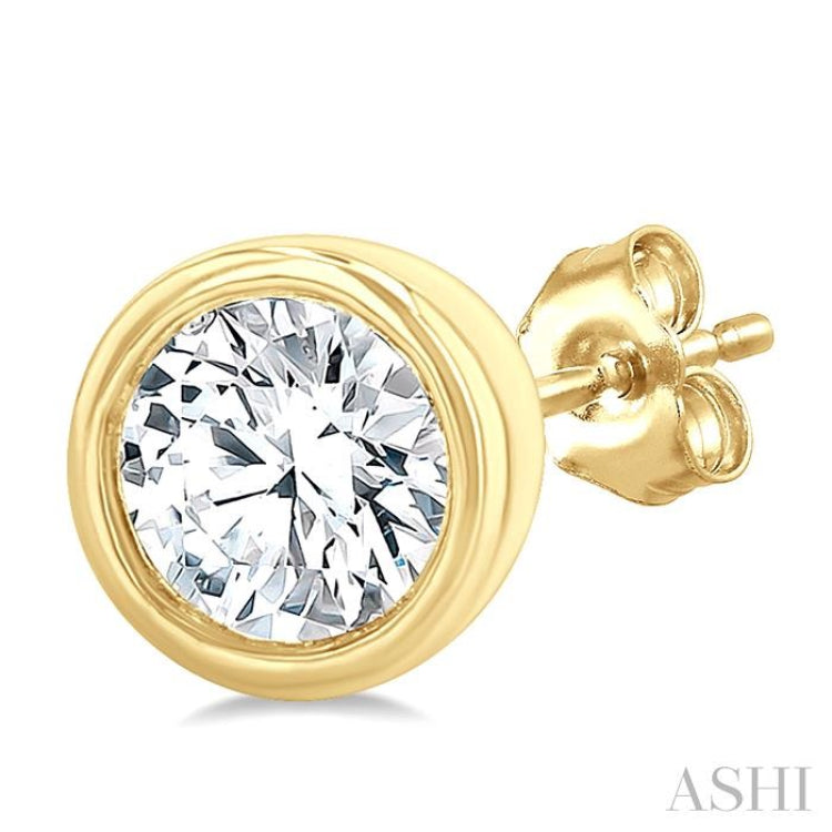 1/5 Ctw Petite Bezel Set Round Cut Diamond Fashion Stud Earrings in 10K Yellow Gold