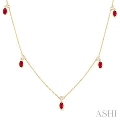 1/8 ctw Round Cut Diamonds and 5X3MM Oval Shape Ruby Precious Station Necklace in 10K Yellow Gold