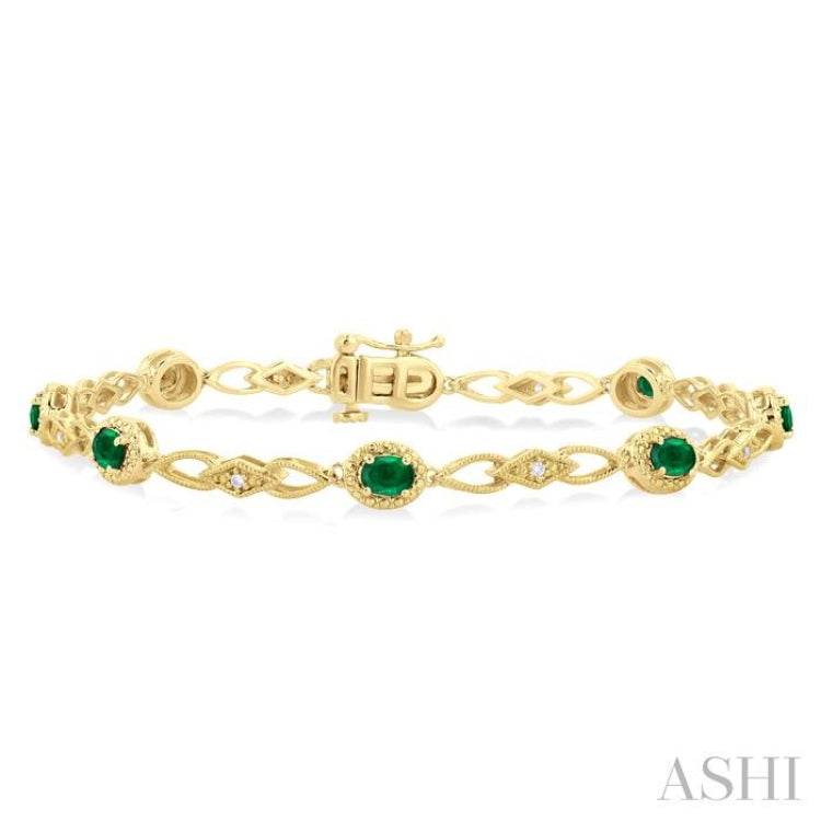 1/20 Ctw Oval Cut 4X3MM Emerald and Round Cut Diamond Precious Fashion Bracelet in 10K Yellow Gold